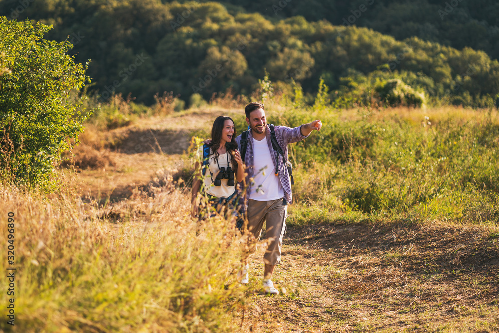 Happy couple is hiking in mountain. Happy couple is hiking in mountain.