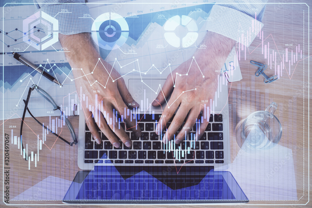 Double exposure of market chart with man working on computer on background. Concept of financial analysis. Double exposure of market chart with man working on computer on background. Concept of financial analysis.