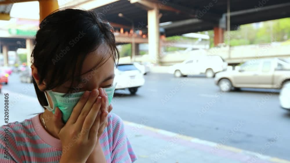 Vidéo Stock Tired asian child girl sneezing,cough wearing hygienic mask