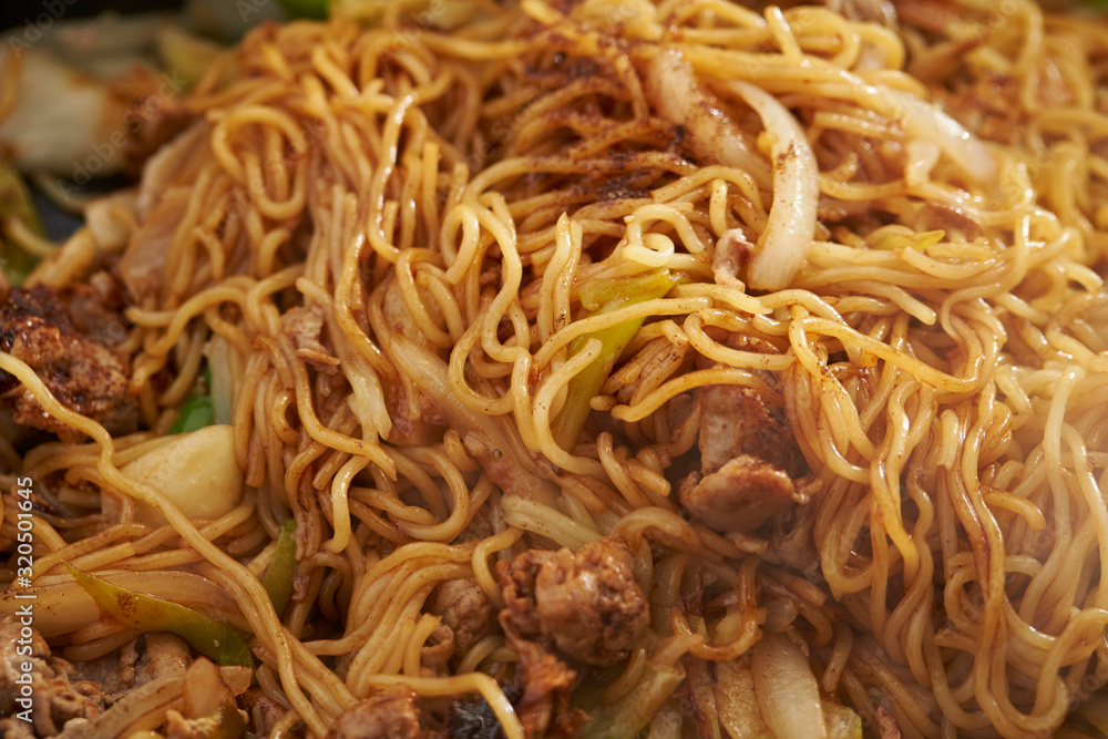 Cooking yakisoba, Japanese stir fried noodle Cooking yakisoba, Japanese stir fried noodle