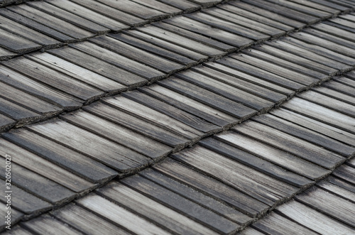 Background of the old roof with wooden boards