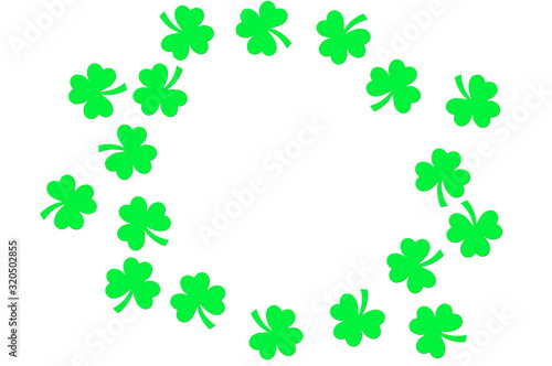 Paper clover leaves on the old wooden background. St.Patrick's day holiday symbol. Space for text, top view