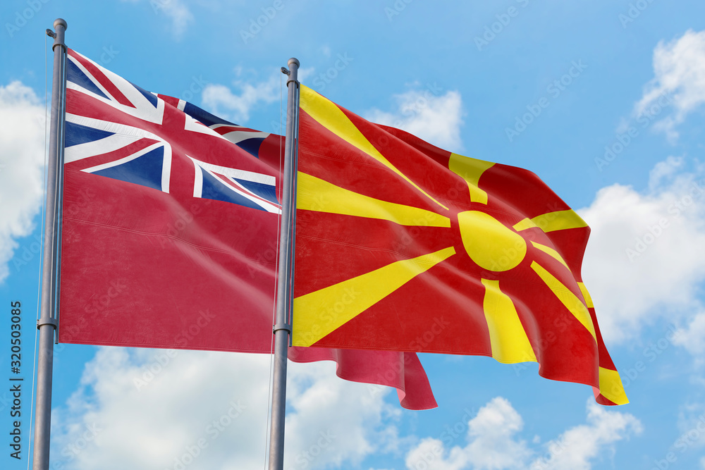 Macedonia and Bermuda flags waving in the wind against white cloudy blue sky together. Diplomacy concept, international relations. Macedonia and Bermuda flags waving in the wind against white cloudy blue sky together. Diplomacy concept, international relations.
