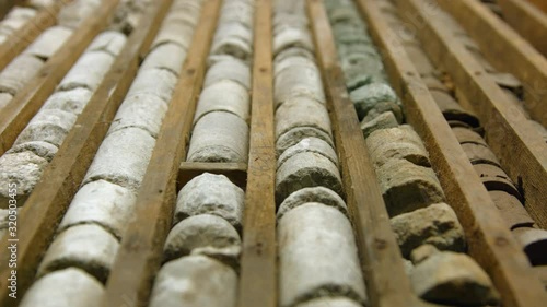 Drill core samples from geological borehole in wooden box