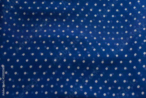 Textile texture of blue dot chiffon, concept of cloth 