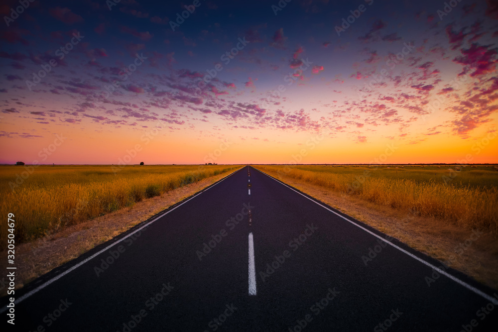 Naklejka premium Australian Highway in Sunset