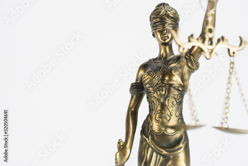 Statue of justice. Law and justice concept. White background with copy space. © Aerial Mike