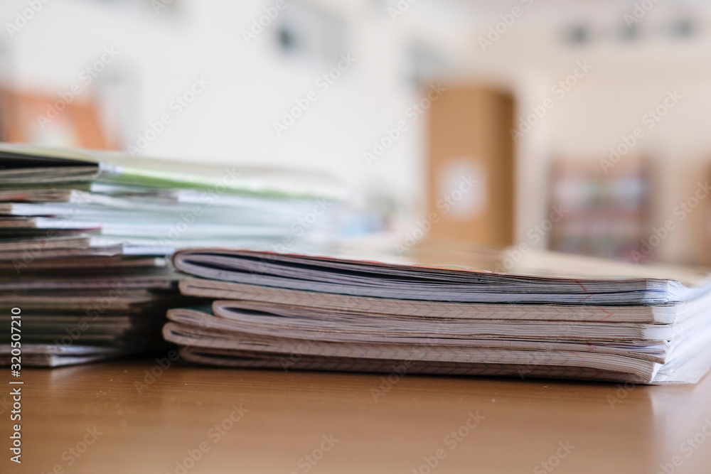 Interior of an empty school class with notebooks on a frontground Interior of an empty school class with notebooks on a frontground