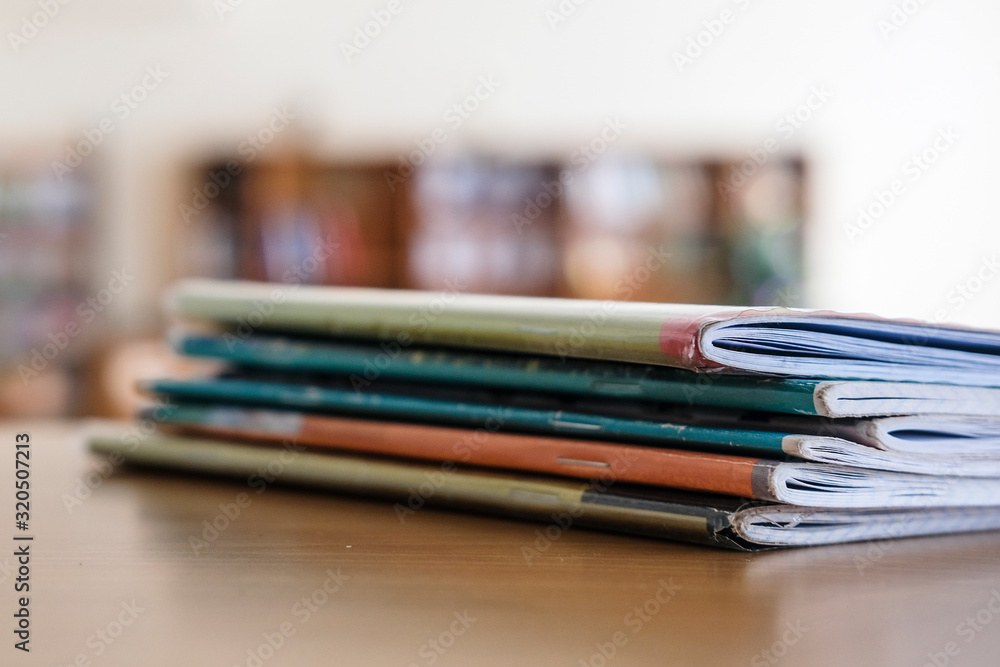 Interior of an empty school class with notebooks on a frontground Interior of an empty school class with notebooks on a frontground