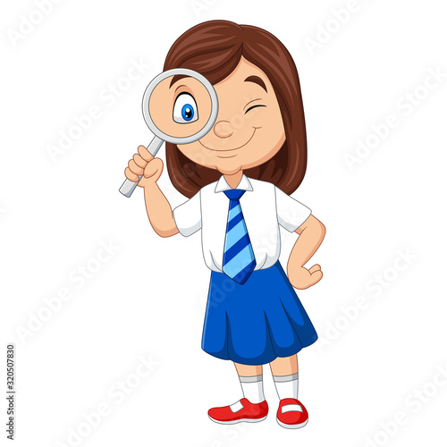 Cute little girl in uniform using magnifying glass