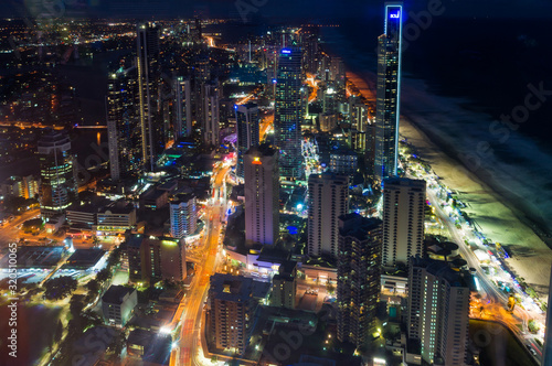 Aerial cityscape of Gold Coast with night illumination and traffic