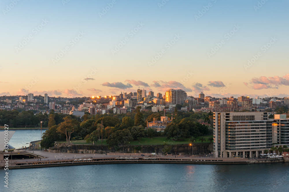 Aerial view of Sydney circular Quay and city suburbs with park at sunrise