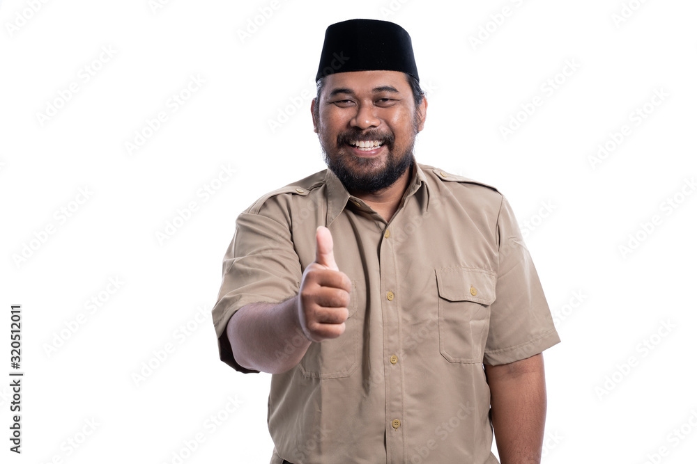 man in brown khaki uniform showing thumb up. indonesian government worker man in brown khaki uniform showing thumb up. indonesian government worker