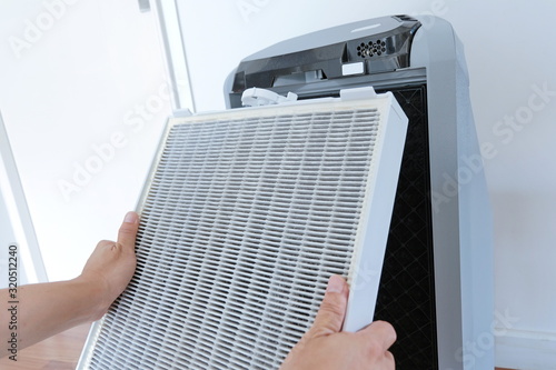 Air purifier. The dirty filter of air purifier after use for long time. PM2.5 concept.