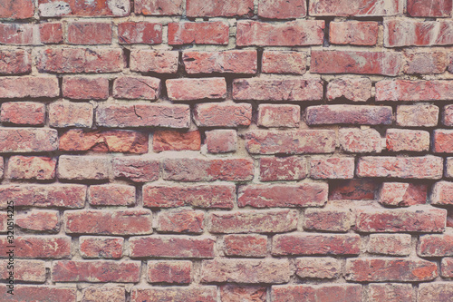 Background of cracked brick wall, texture of destroyed brickwork