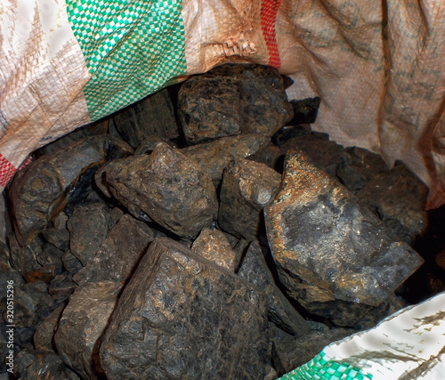 Coltan ore contains metals of Tantalum and Niobium  photo