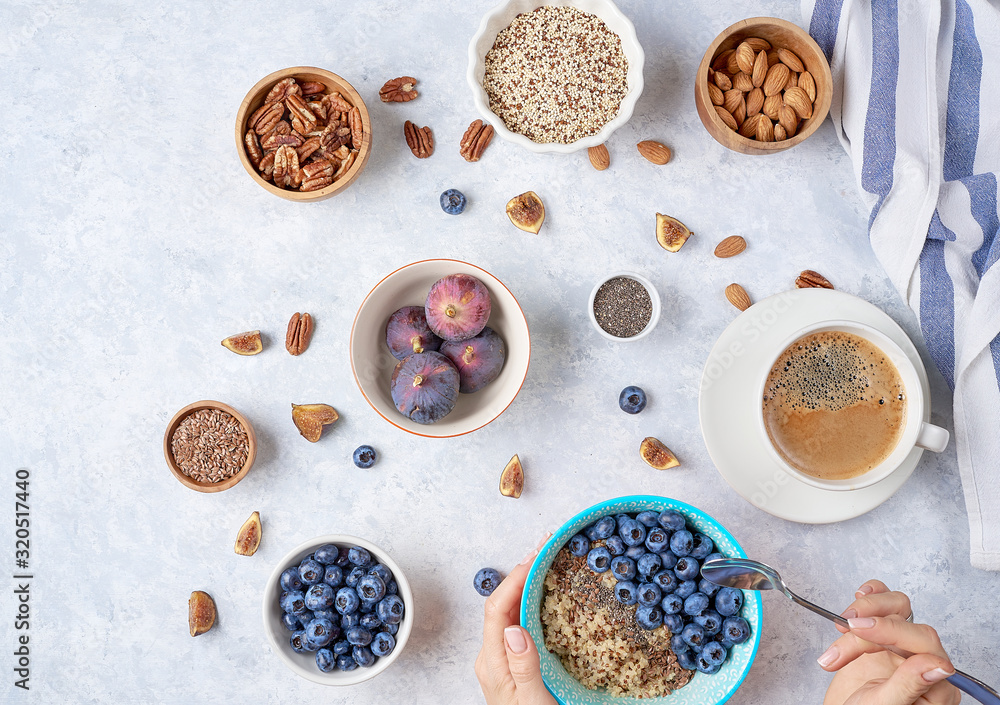 Healthy breakfast of superfoods, quinoa, honey, nuts, figs, coffee. Top view Healthy breakfast of superfoods, quinoa, honey, nuts, figs, coffee. Top view