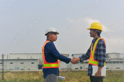 Businessman Shake hands engineer construction success construction building project, Hand shake agreement