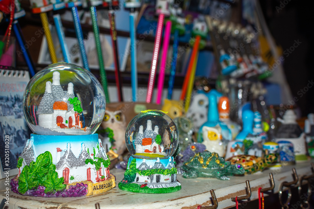 Colored souvenirs from Alberobello, South of Italy on Blurred background