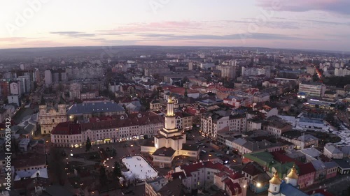 Aerial sunset view of the center of Ivano Frankivsk city in the evening, Ukraine. Old historical buildings of european town. photo