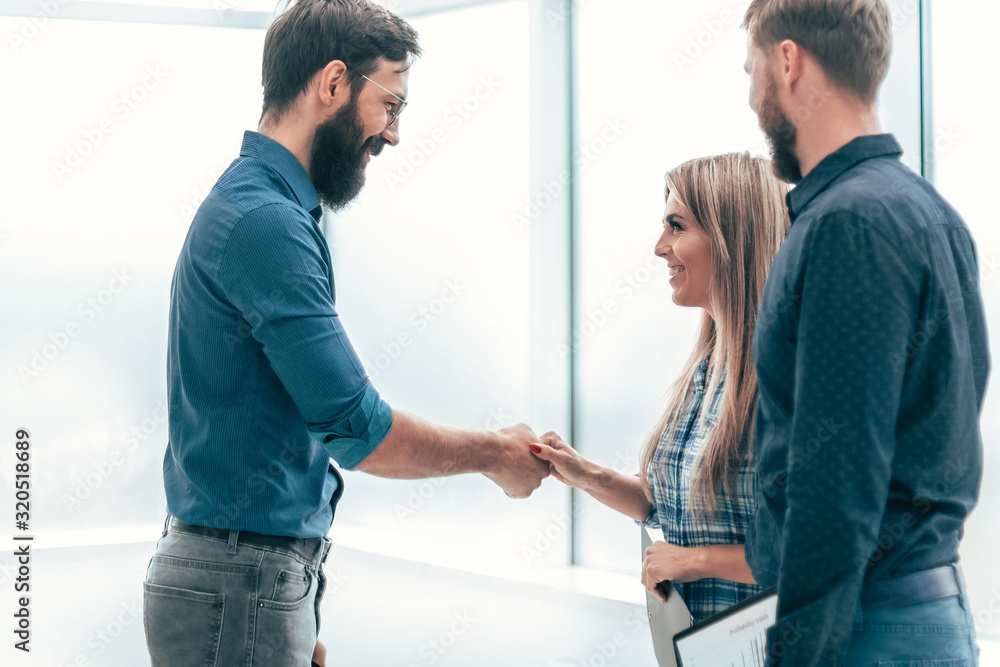 young entrepreneurs shaking hands with each other young entrepreneurs shaking hands with each other