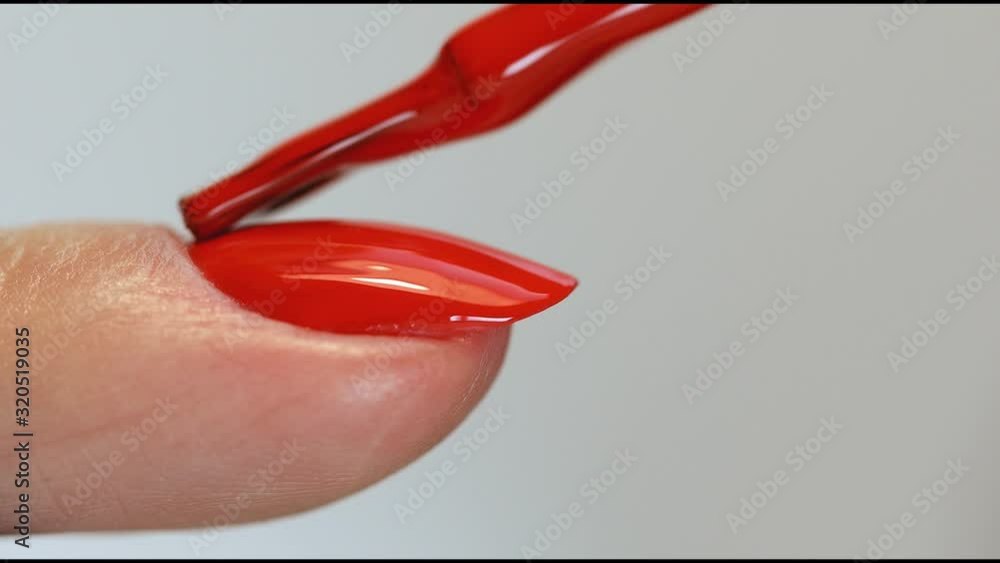 Manicure nail paint. Master applies gel polish on nails in manicure salon. Nail polish. Manicure nail paint. Master applies gel polish on nails in manicure salon. Nail polish.