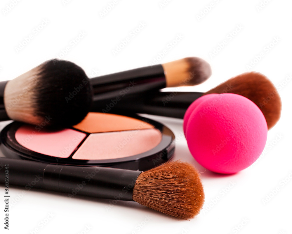 Make-up brushes and cosmetics isolated on a white background. Make-up brushes and cosmetics isolated on a white background.