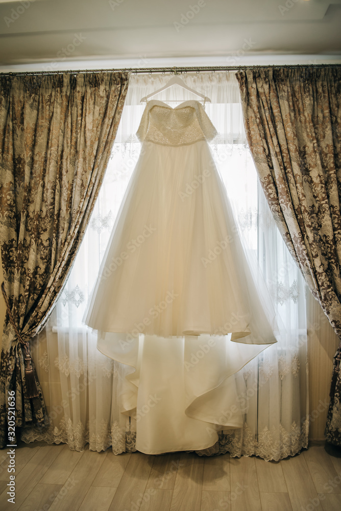 Stylish elegant white bride dress with a train