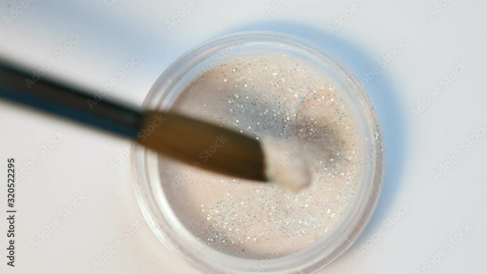 Master applies acrylic with brush Master applies acrylic with brush