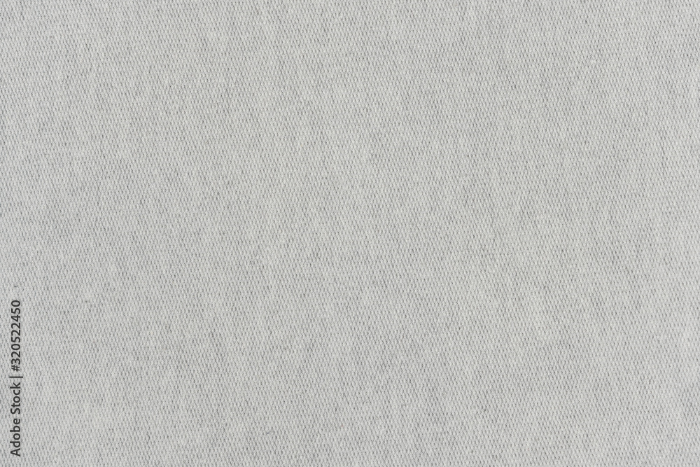 White natural texture of knitted wool textile material background. White cotton fabric woven canvas texture White natural texture of knitted wool textile material background. White cotton fabric woven canvas texture