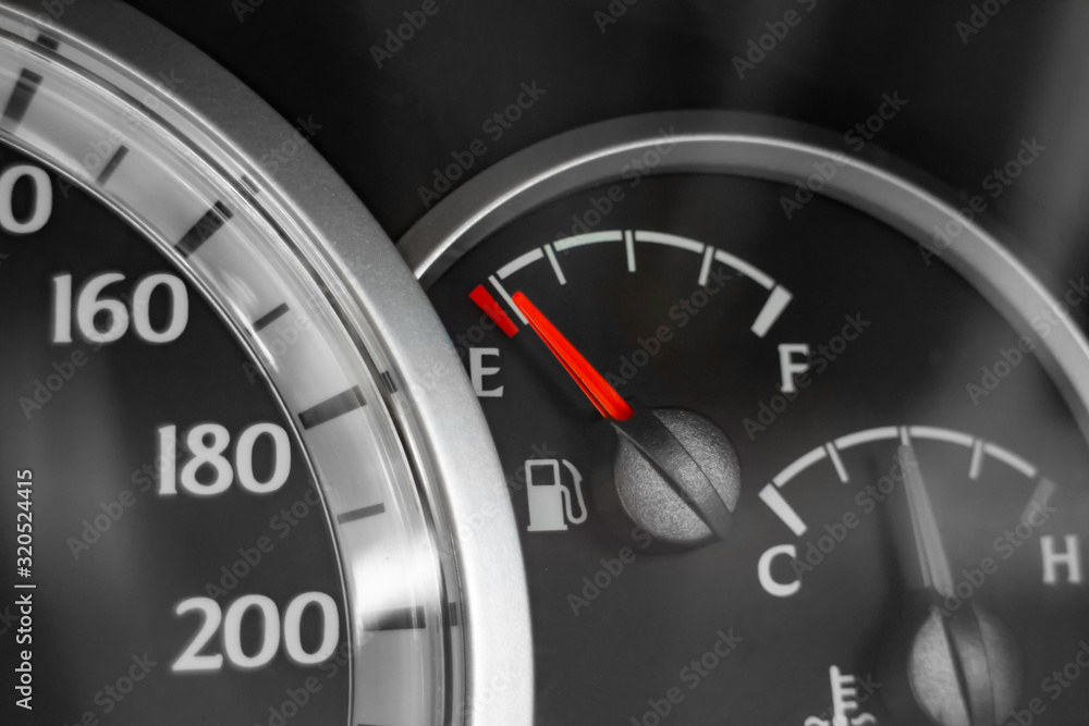 Close-up of car dashboard showing speedometer, fuel indicator and temperature indicator. Close-up of car dashboard showing speedometer, fuel indicator and temperature indicator.