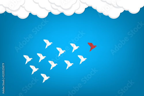 Red bird changing direction and white ones. New idea, change, trend, courage, creative solution, business, innovation and unique way concept