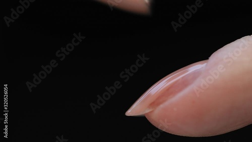 Manicure nail paint. Master applies gel polish on nails  in manicure salon. Nail polish.