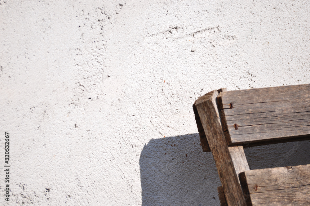 Gray wall texture and wooden object Gray wall texture and wooden object
