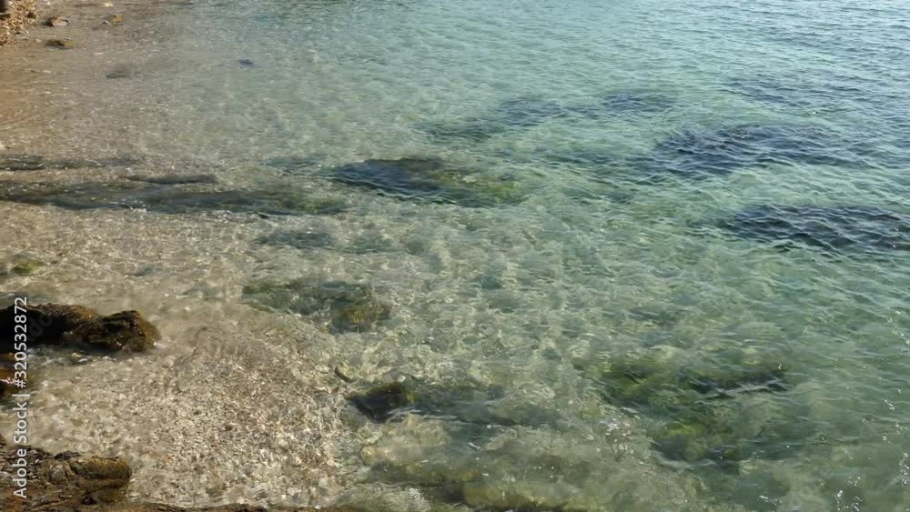Simmering reflexions of surface water in a small pool by the sea shore. Simmering reflexions of surface water in a small pool by the sea shore.
