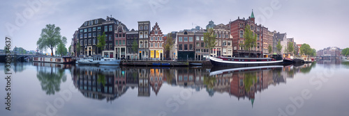 Cityscape of Amsterdam with reflection of buildings on water