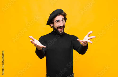 Fotografie young french artist man feeling happy, astonished, lucky and surprised, like say