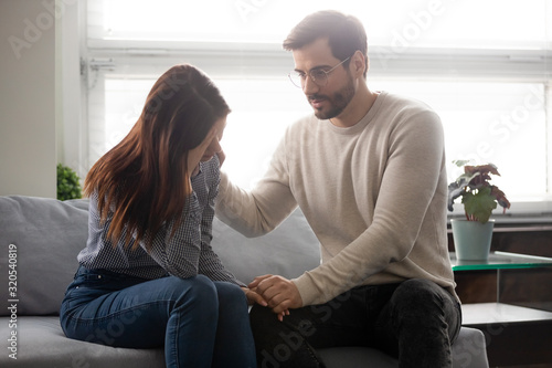 Slika na platnu Guy reassures beloved girl holds her hand showing sincere care