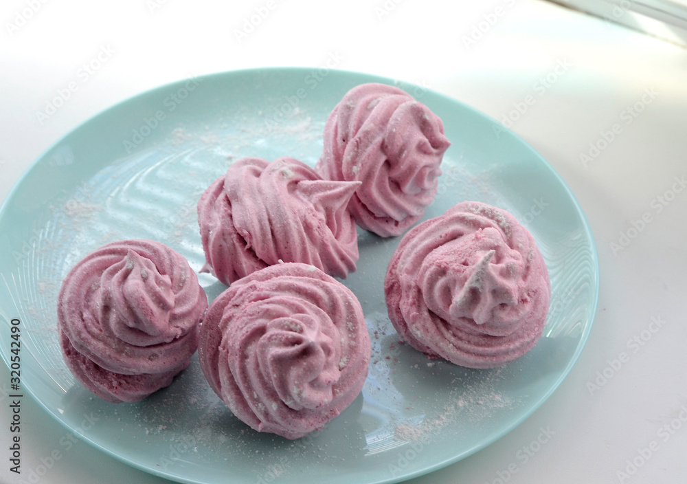 Homemade strawberry puree marshmallow with icing sugar Homemade strawberry puree marshmallow with icing sugar