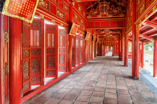 Amazing red wooden hallway in the Purple Forbidden City, Hue