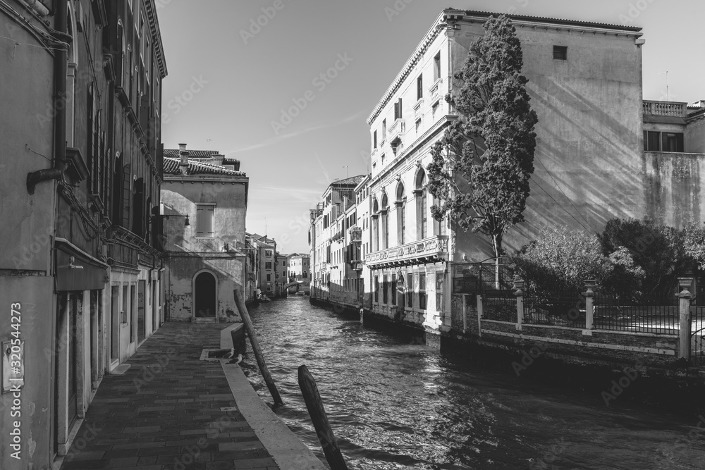Fototapeta premium Venice in Black and White. Art reflections in the days of the carnival. Italy