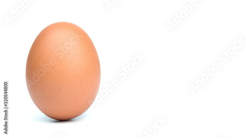 Single brown eggs isolated from white background with copy space for writing text.