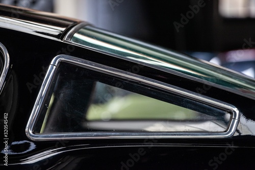 rear window of black classic fastback car photo