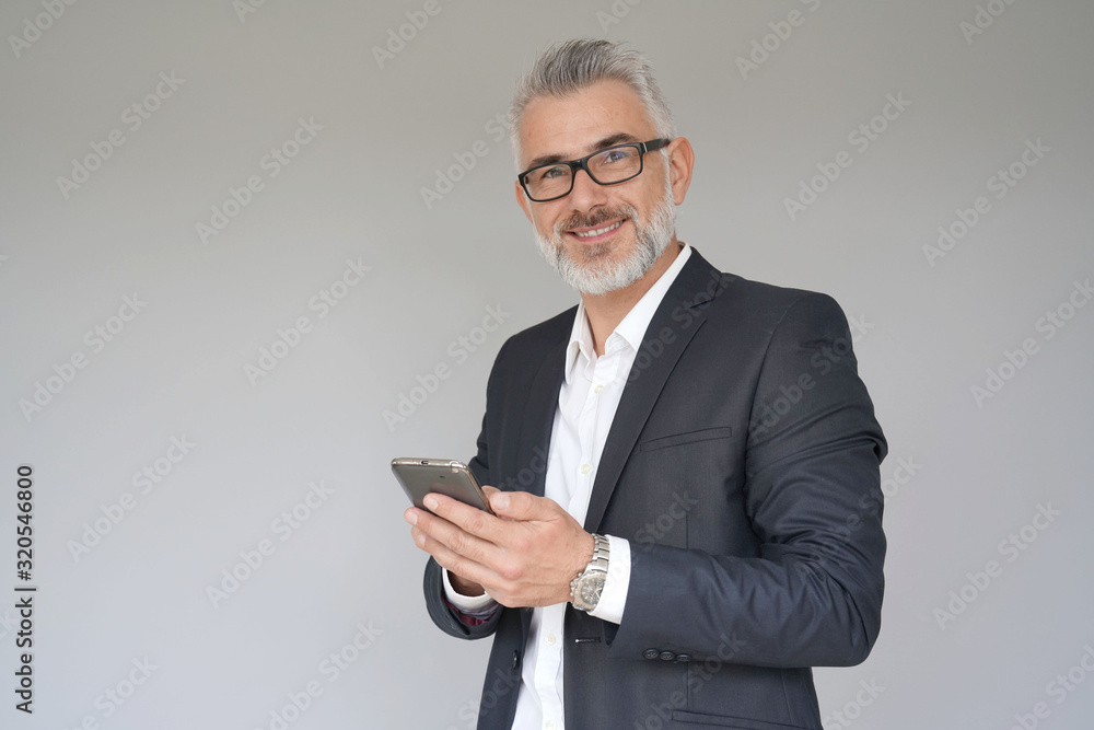 Businessman using smartphone, isolated Businessman using smartphone, isolated