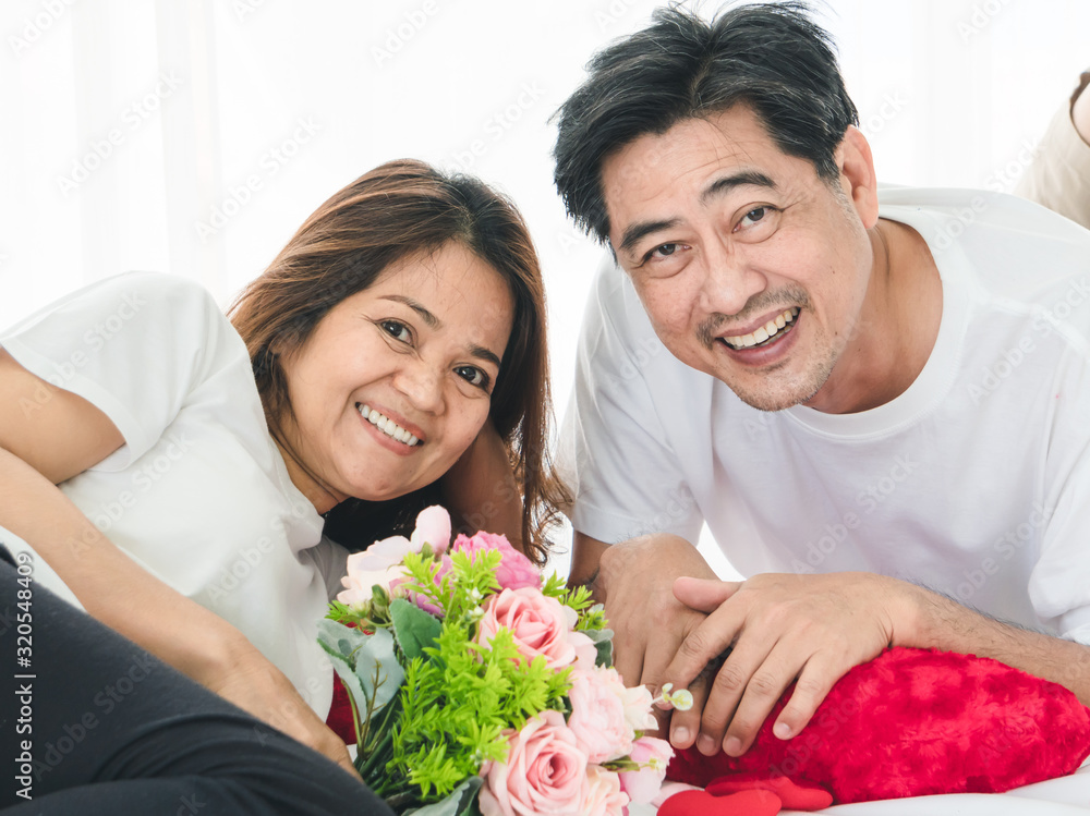 Senior Asian lovers, staying at home and enjoying being together Senior Asian lovers, staying at home and enjoying being together