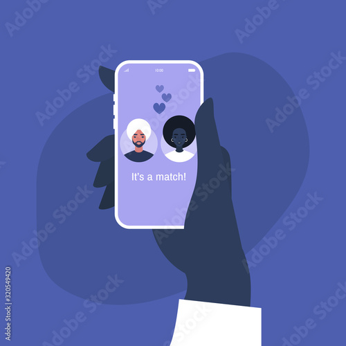 Hand holding a smart phone with a dating service mobile application on it, interracial relationships
