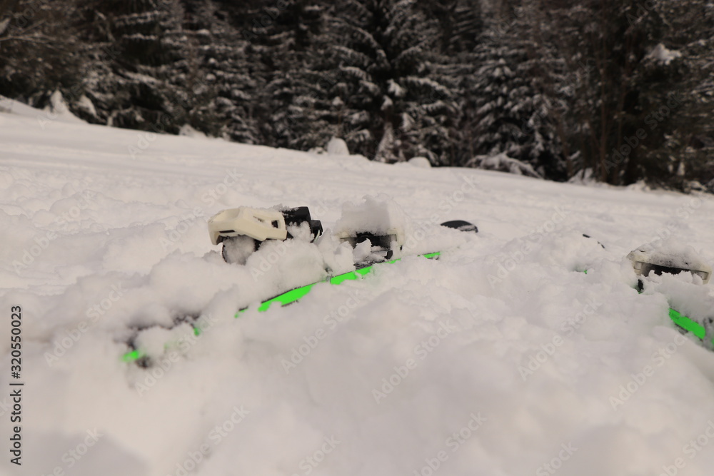 Black and green ski dives in snow on peak of mountain in Beskydy, czech republic, europe. New famous equipment for every active human. Black and green ski dives in snow on peak of mountain in Beskydy, czech republic, europe. New famous equipment for every active human.