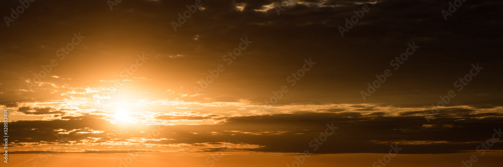 Sunset with clouds. Wide image