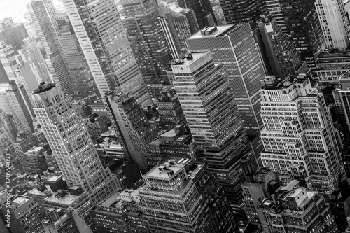 Aerial view of New York skyline with Manhattan midtown urban skyscrapers, New York City, USA. Black and white image.