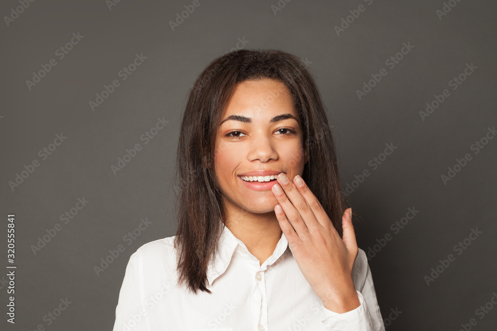 Indoor portrait of happy brunette young dark woman laughing Indoor portrait of happy brunette young dark woman laughing